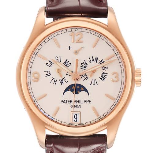 The Patek Philippe Complications Model 72689 watch is shown from the front, displaying its brown leather strap, gold case, and detailed dial with calendar functions.