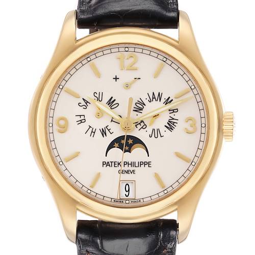 The Patek Philippe Complications model 5146J watch is shown from a front angle, displaying the dial, gold case, moon phase, and calendar features, with a leather strap.