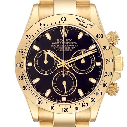 The image shows a frontal view of the Rolex Daytona model 116528 men's watch, highlighting its gold case, black dial, sub-dials, and tachymetric scale.