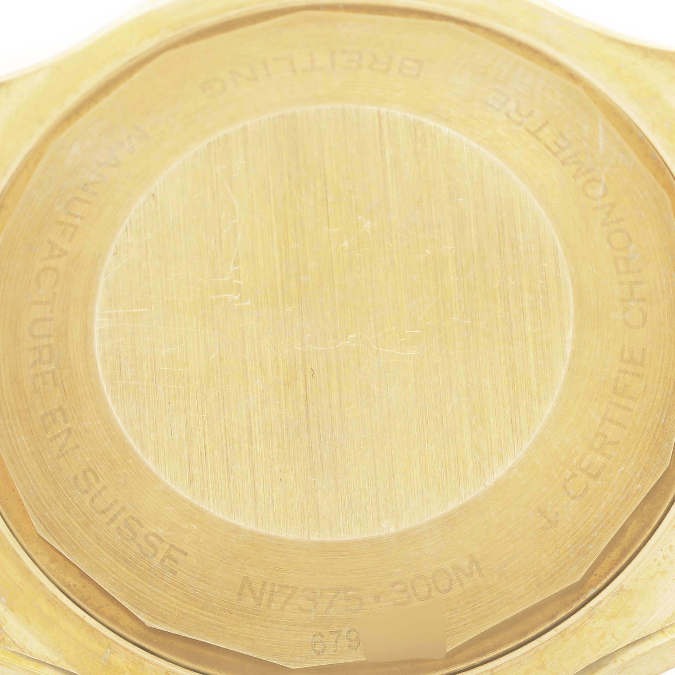 This close-up image shows the back case of a Breitling Superocean N17375 Men's Yellow Gold Green Dial N17375 Men's Yellow Gold Green Dial watch.
