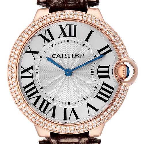 The Cartier Ballon Bleu model WE902055 men's watch is shown in a close-up, front-facing angle highlighting the dial, Roman numerals, and diamond-studded bezel.
