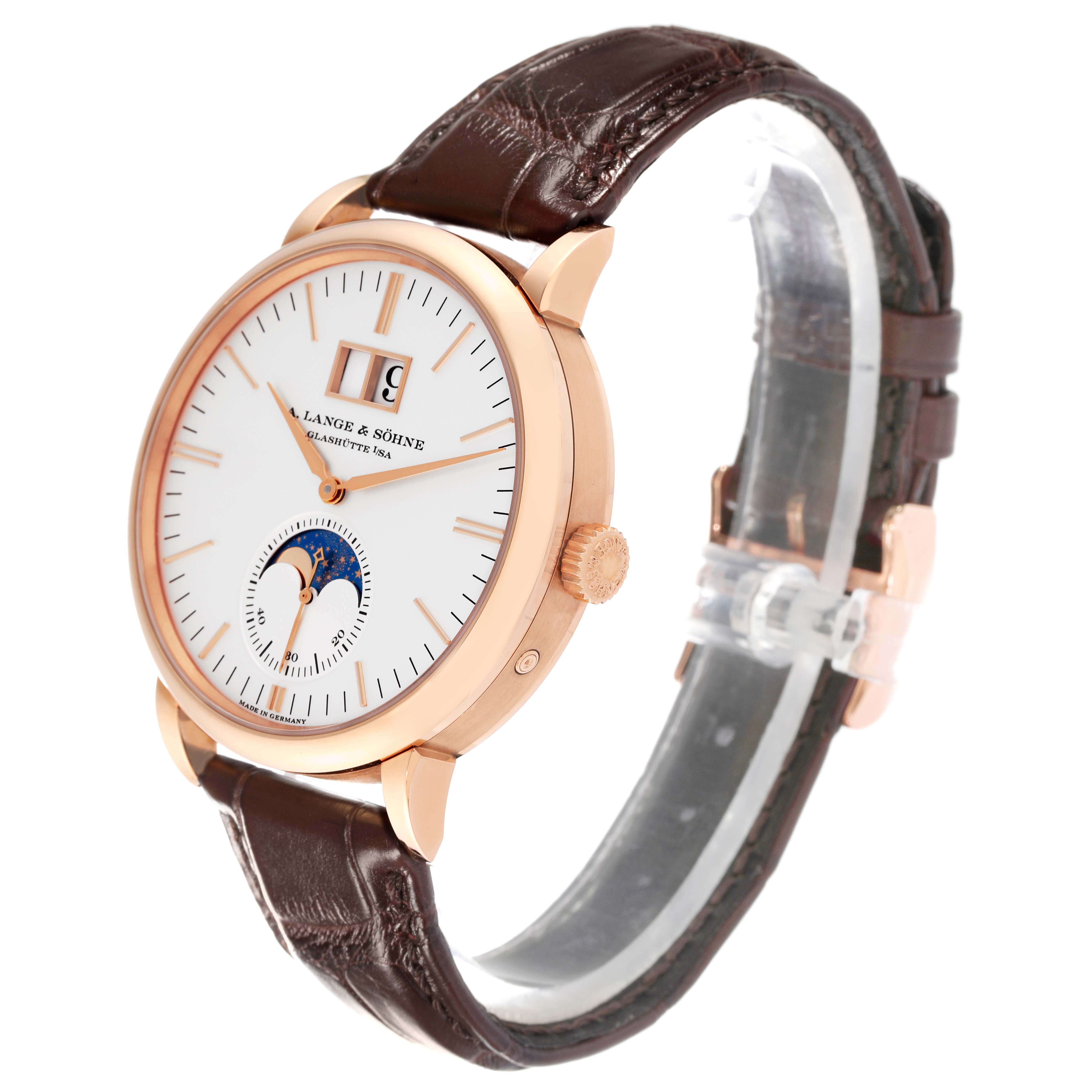 The image shows a side angle of the A. Lange & Sohne Saxonia 384.032 Men's Rose Gold Silver Dial watch, highlighting the face, crown, and leather strap.