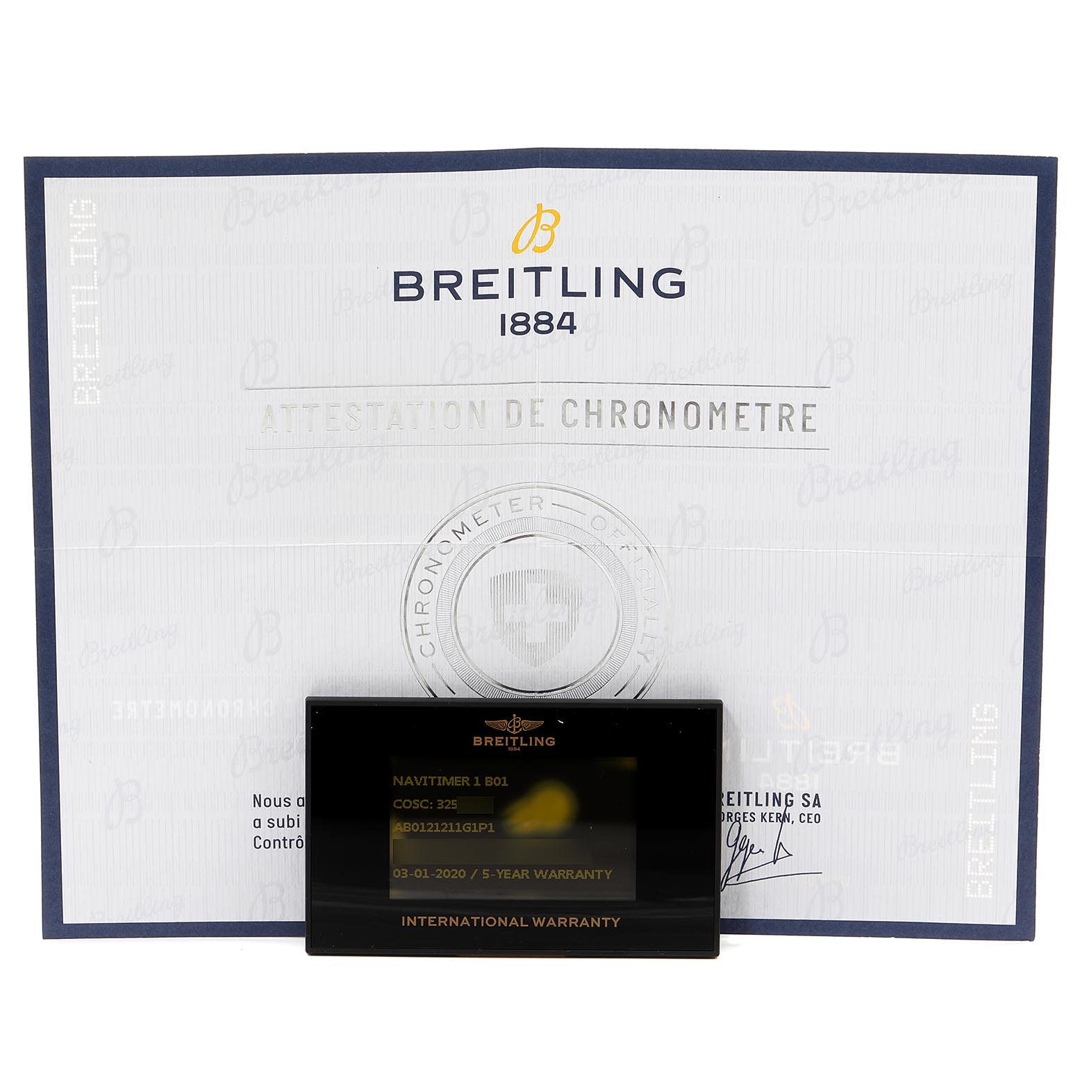 The image displays a warranty card and certificate for the Breitling Navitimer AB0120 Men's Stainless Steel Silver Dial AB0120 Men's Stainless Steel Silver Dial model, taken from a front angle.