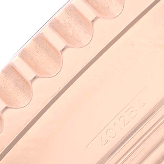 This close-up image shows the side of a bezel or part of the watch case for the Breitling Navitimer RB0120 Men's Rose Gold Black Dial RB0120 Men's Rose Gold Black Dial model.