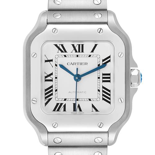 The Cartier Santos WSSA0029 Men's Stainless Steel Silver Dial watch is shown front-facing, highlighting its square dial, Roman numerals, blue hands, and metal bracelet.