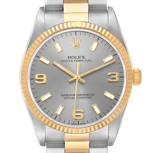The image shows a frontal view of a Rolex Oyster Perpetual 14233 Men's Steel and Gold (two tone) Silver Dial 14233 Men's Steel and Gold (two tone) Silver Dial watch, displaying its dial, bezel, crown, and bracelet.