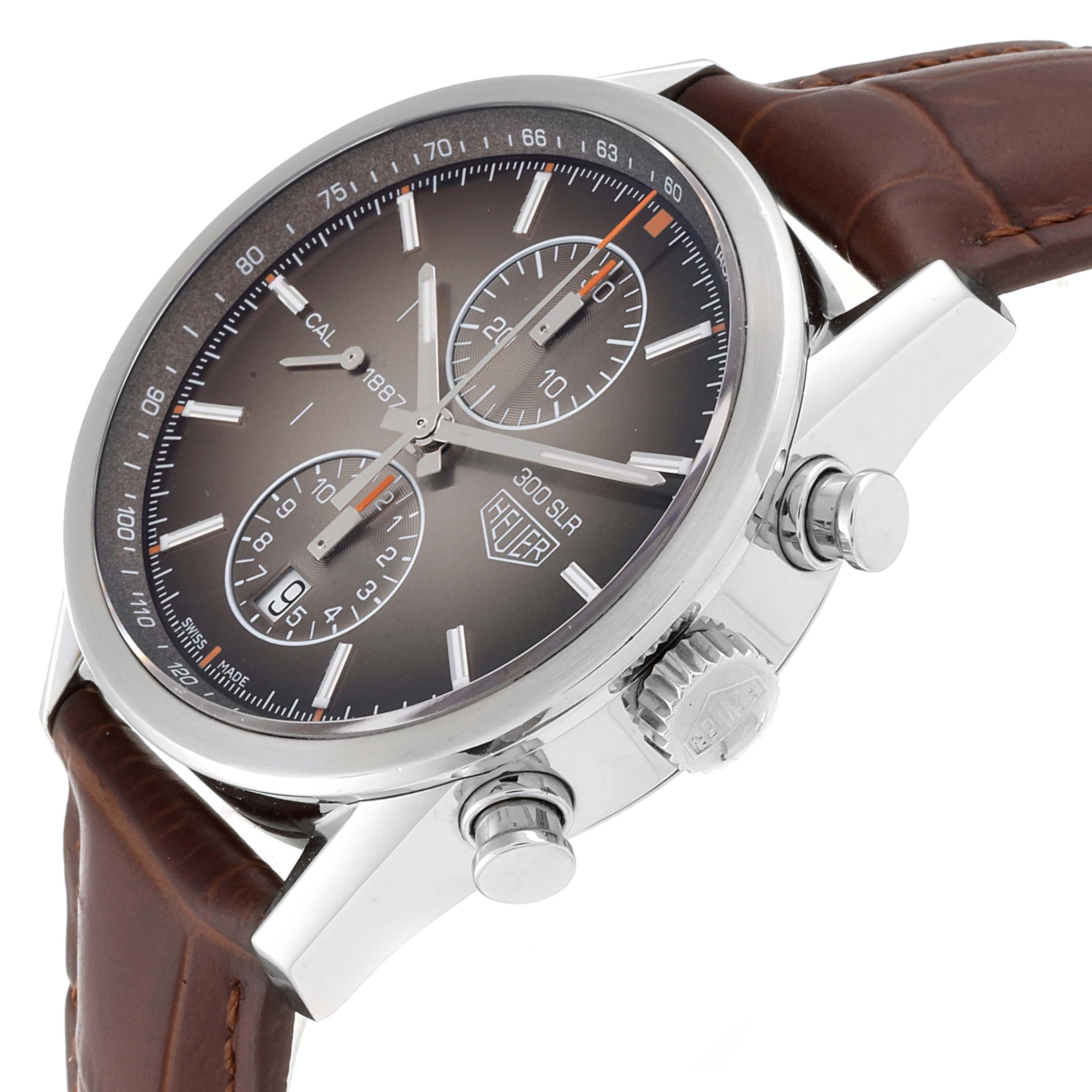 The Tag Heuer Carrera CAR2112.FC6267 Men's Stainless Steel Brown Dial CAR2112.FC6267 Men's Stainless Steel Brown Dial watch is shown at an angled side view, displaying its dial, crown, pushers, and leather strap.