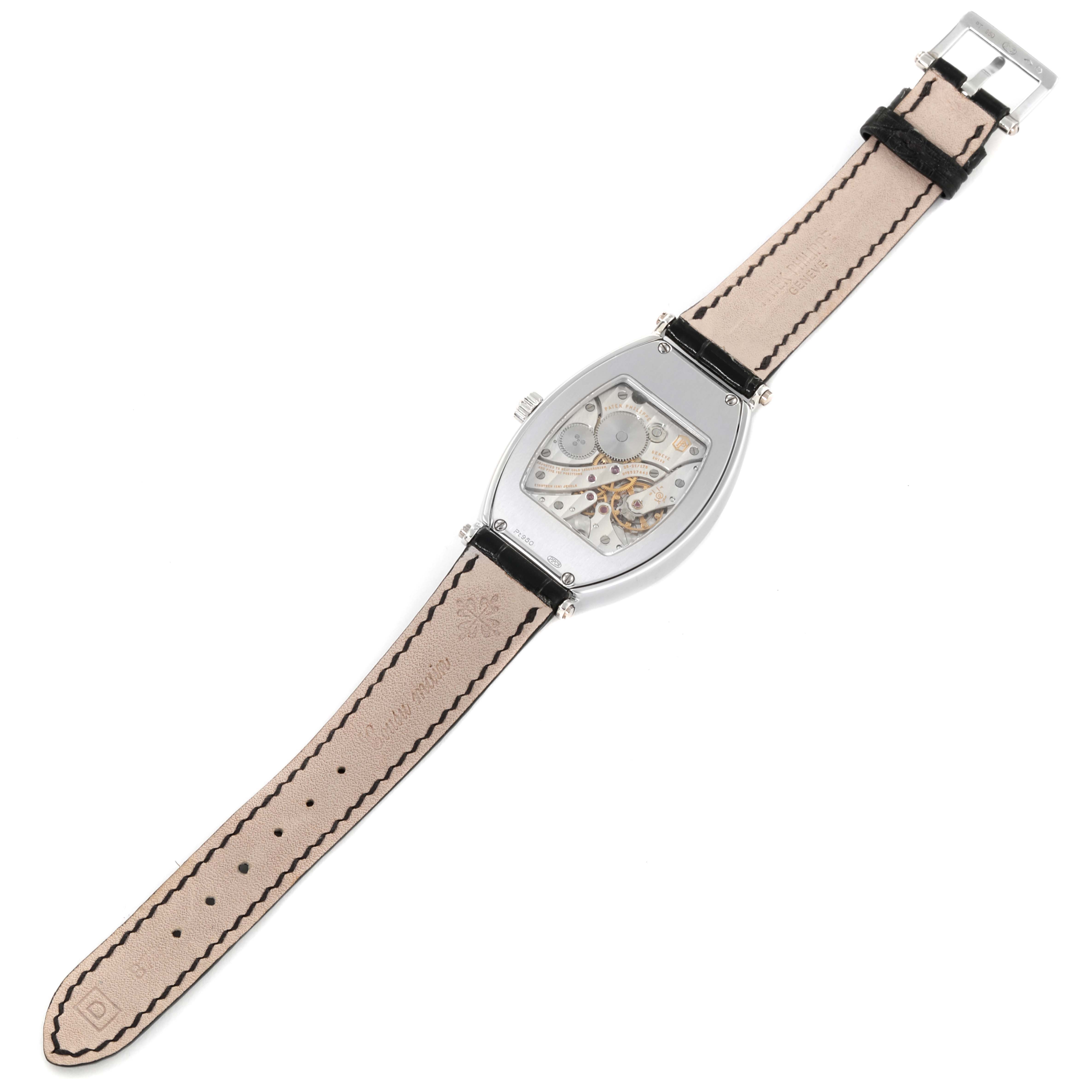 The image shows the back view of a Patek Philippe Gondolo 5098P Men's Platinum Silver Dial 5098P Men's Platinum Silver Dial watch, displaying its movement and leather strap.