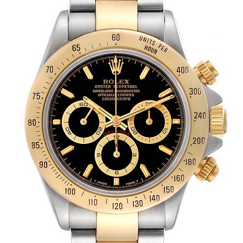 The image shows a front view of the Rolex Daytona 16523 Men's Steel and Gold (two tone) Black Dial 16523 Men's Steel and Gold (two tone) Black Dial watch, highlighting its gold bezel, black dial, and chronograph sub-dials.