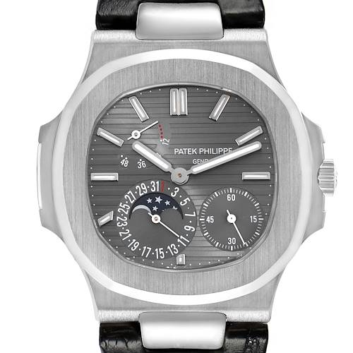 The image shows a frontal view of the Patek Philippe Nautilus 5712G Men's White Gold Grey Dial watch, highlighting the dial features and complications.