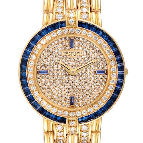 This image shows the face and partial gold bracelet of the Patek Philippe 3982/11 Women's Yellow Gold  3982/11 Women's Yellow Gold  3982 18k Yellow Gold Diamond Sapphires Ladies Watch.