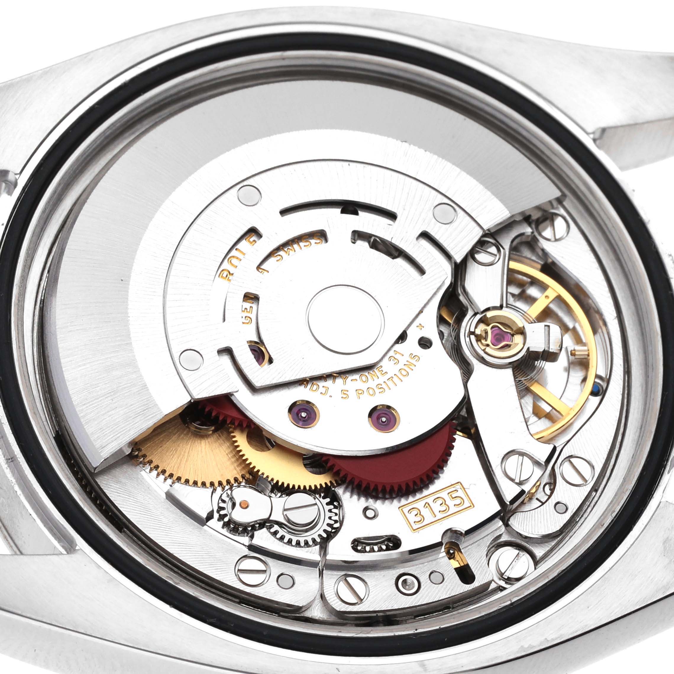 This image shows the internal movement of a Rolex Datejust 116234 Men's Stainless Steel Silver Dial 116234 Men's Stainless Steel Silver Dial model watch at an angled close-up.