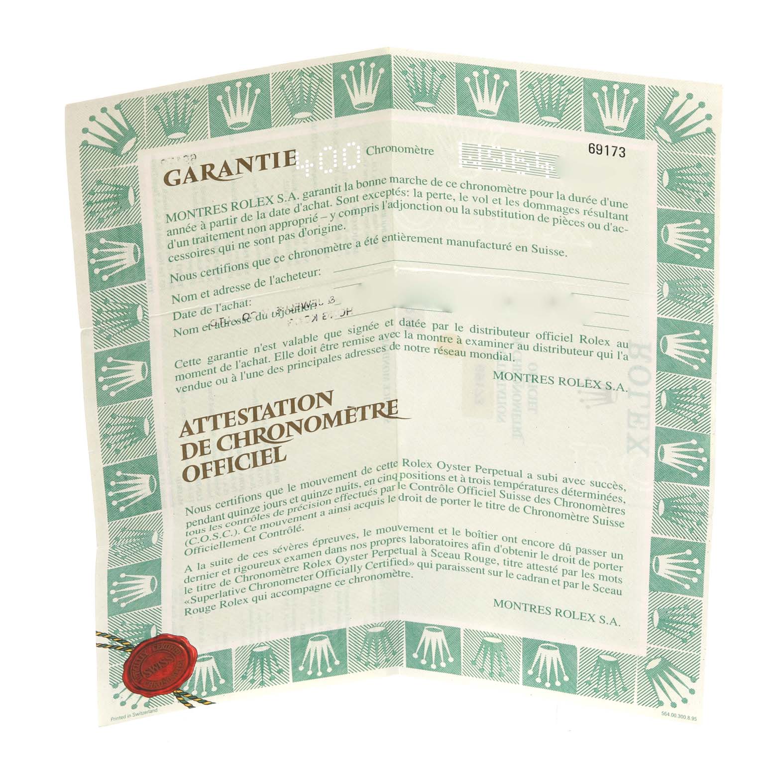 The image shows a warranty and chronometer certificate for a Rolex Datejust 69173 Women's Steel and Gold (two tone) Champagne Dial 69173 Women's Steel and Gold (two tone) Champagne Dial model, photographed at a slightly tilted angle.