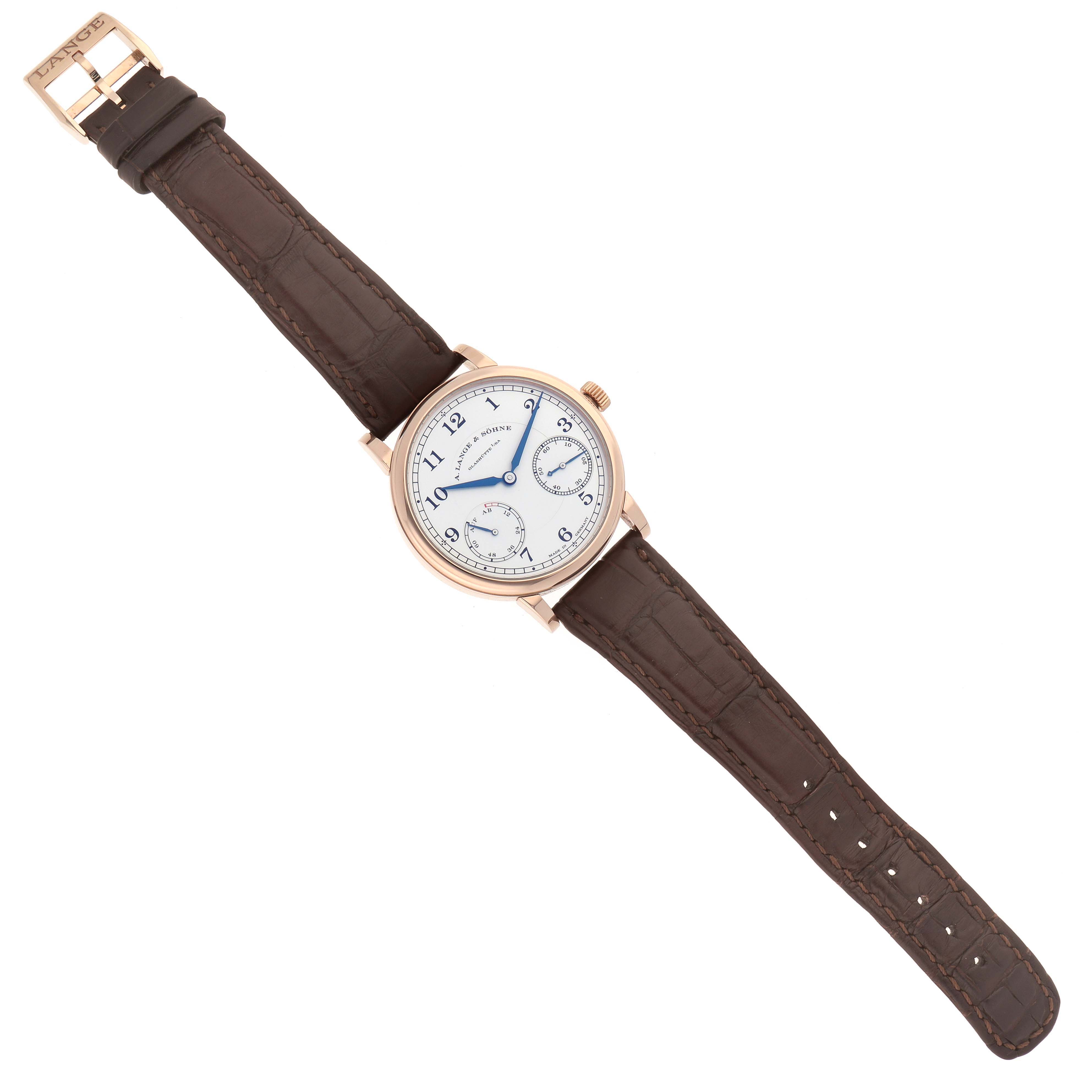 The A. Lange & Sohne 1815 234.032 Men's Rose Gold Silver Dial watch is shown from a top-down angle, with a brown leather strap and a white dial featuring blue hands.