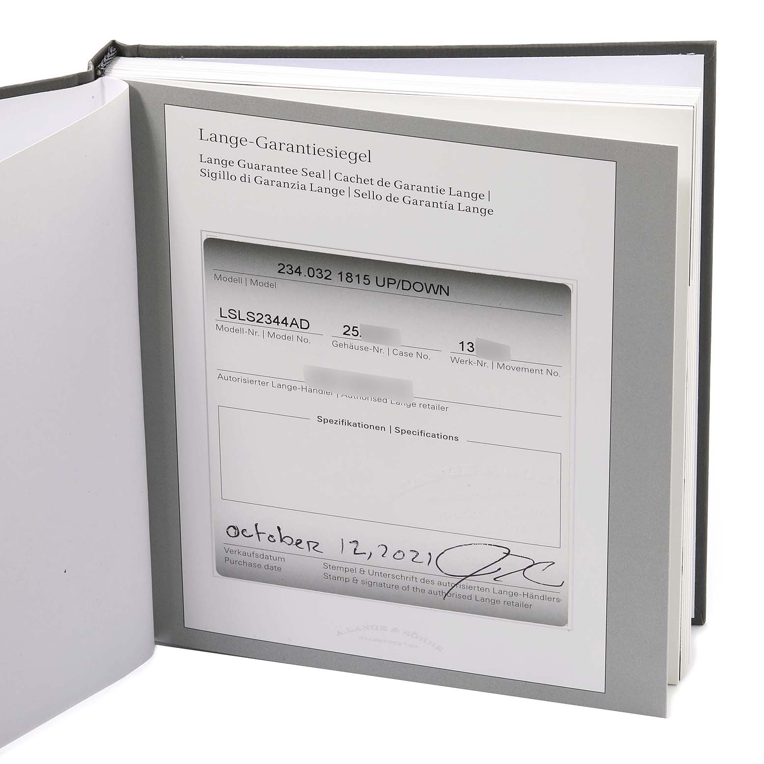 This image shows the guarantee certificate for the A. Lange & Sohne 1815 234.032 Men's Rose Gold Silver Dial model watch inside an open book or folder.
