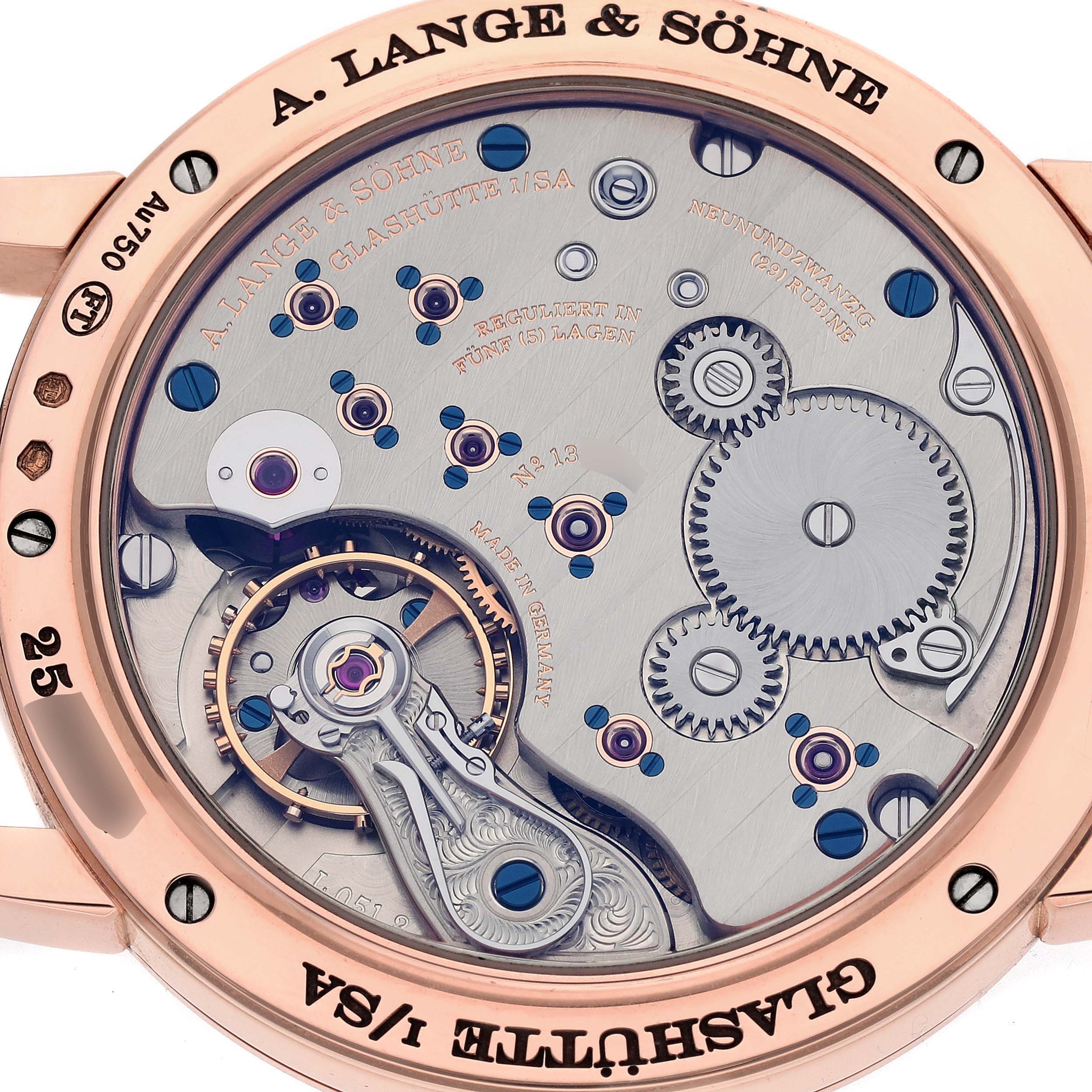 The image shows a close-up of the movement and inner mechanisms of an 1815 model by A. Lange & Söhne from the back.