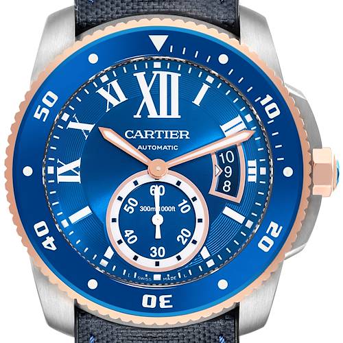 The image shows a close-up of the Calibre de Cartier watch face and bezel, focusing on its blue dial and silver and gold accents.