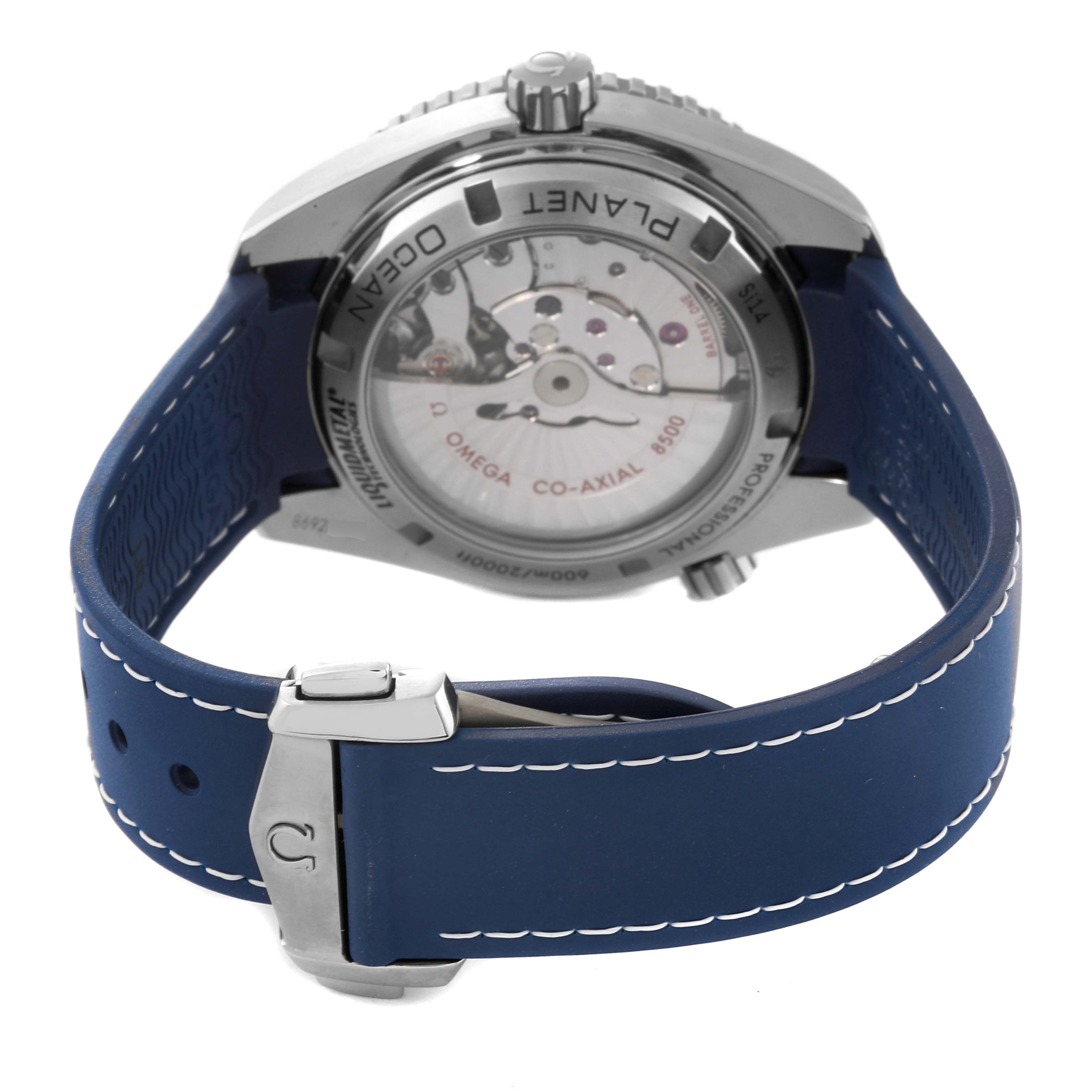 The image shows the back view of an Omega Planet Ocean 232.92.42.21.03.001 Men's Titanium Blue Dial 232.92.42.21.03.001 Men's Titanium Blue Dial model watch, featuring its open case back and blue strap.