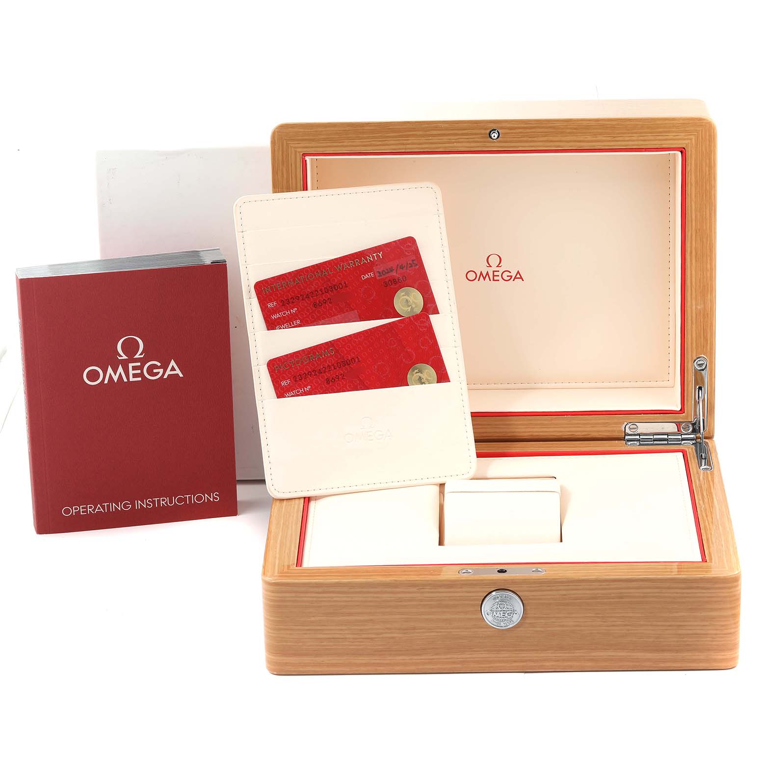 The image shows a wooden Omega Planet Ocean 232.92.42.21.03.001 Men's Titanium Blue Dial 232.92.42.21.03.001 Men's Titanium Blue Dial watch box, warranty cards, and an operating instructions booklet.