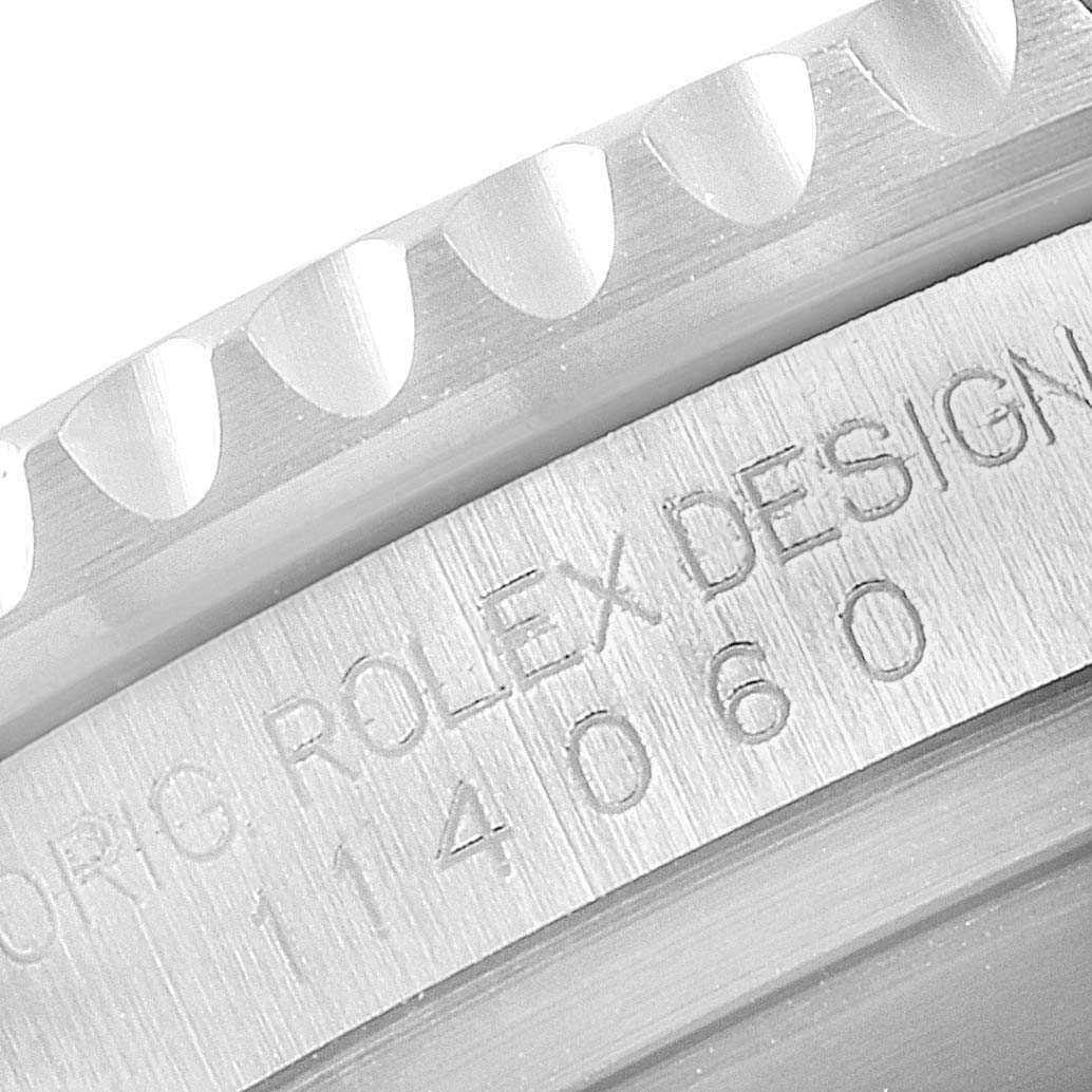 This image shows a close-up of the case side and bezel of a Rolex Submariner 114060 Men's Stainless Steel Black Dial 114060 Men's Stainless Steel Black Dial, focusing on its engraved model number.