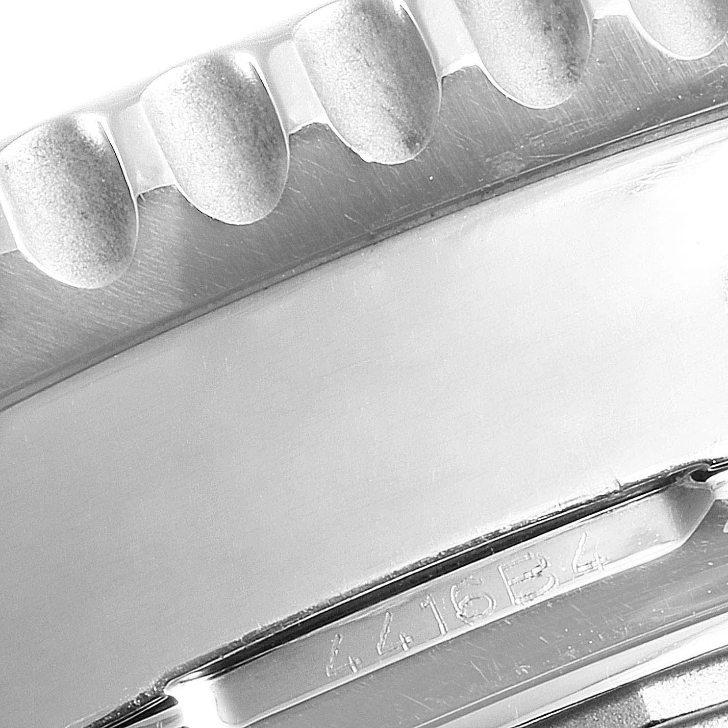 This image shows a close-up of the bezel and casing edge of a Breitling Navitimer AB044121/BD24/443A Men's Stainless Steel Black Dial AB044121/BD24/443A Men's Stainless Steel Black Dial watch.