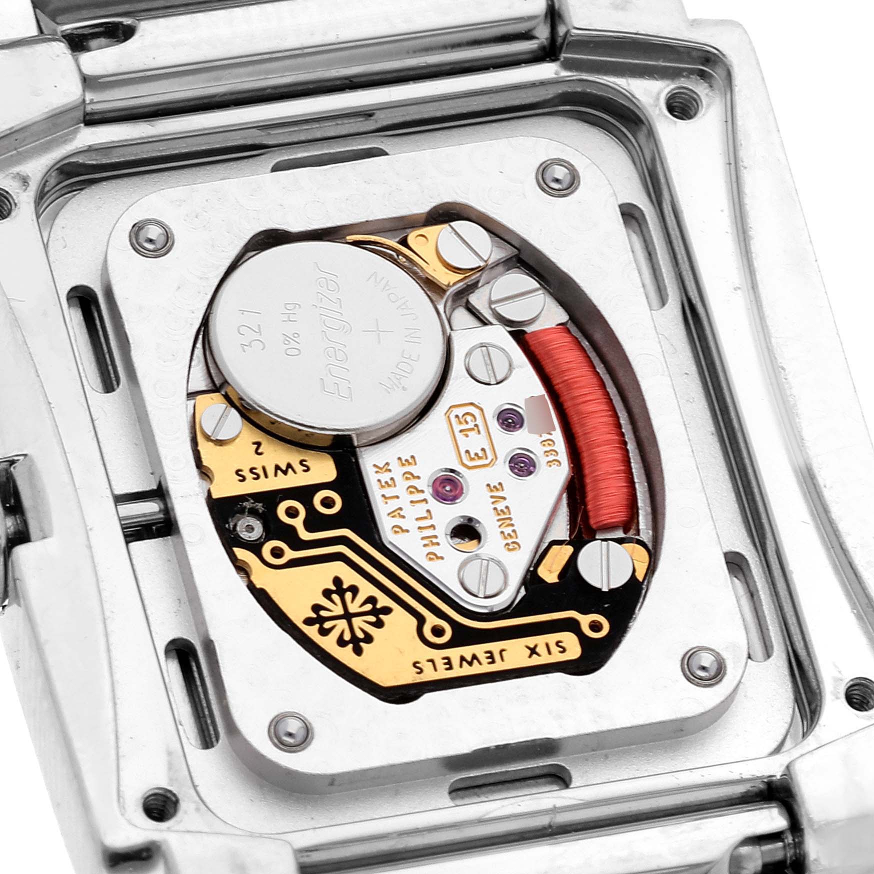 The image shows the back of a Patek Philippe Twenty-4 4910/10 Women's Stainless Steel Grey Dial 4910/10 Women's Stainless Steel Grey Dial watch, revealing its internal mechanics and battery.