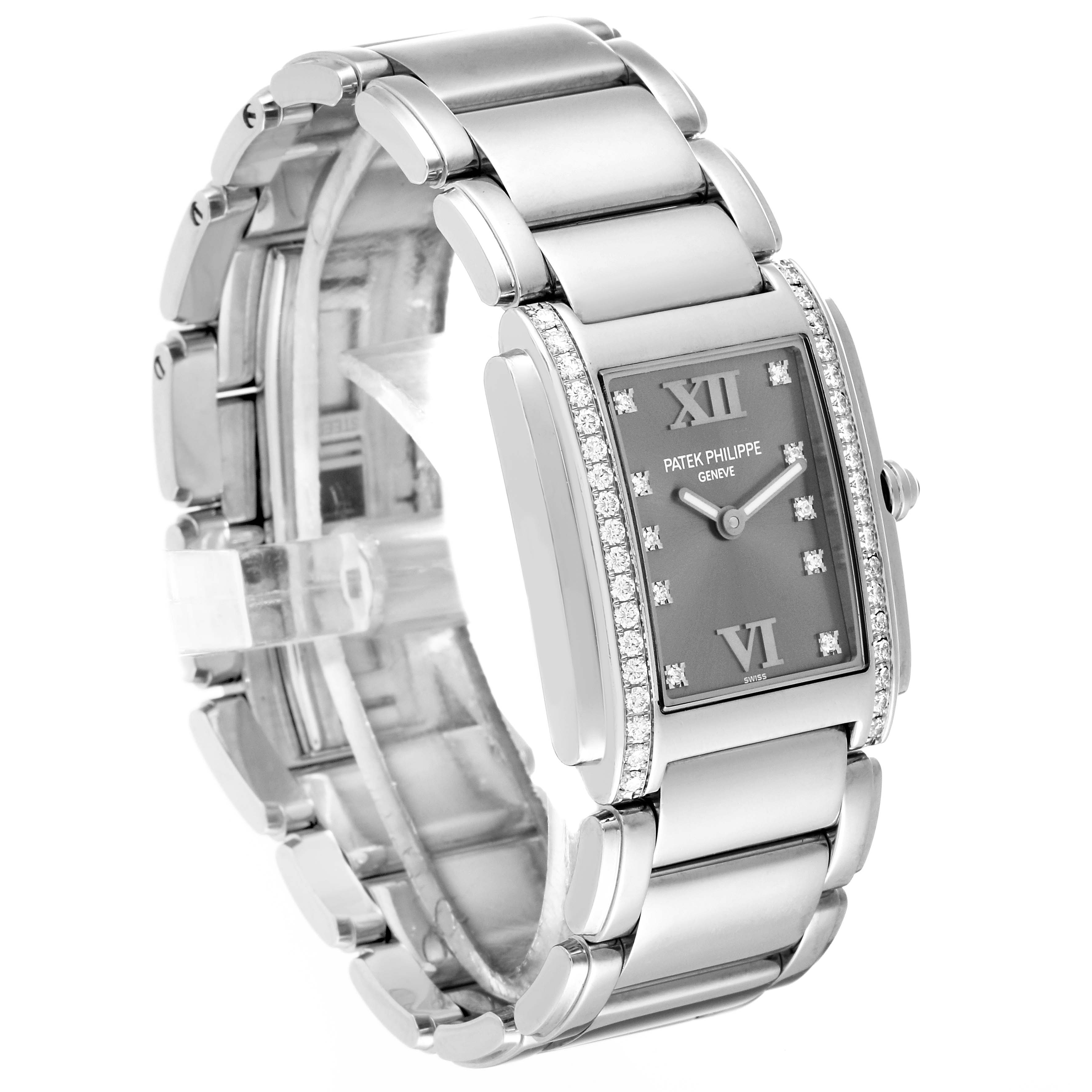 The Patek Philippe Twenty-4 4910/10 Women's Stainless Steel Grey Dial 4910/10 Women's Stainless Steel Grey Dial watch is shown at a slight angle, displaying its bracelet, dial, and bejeweled bezel.