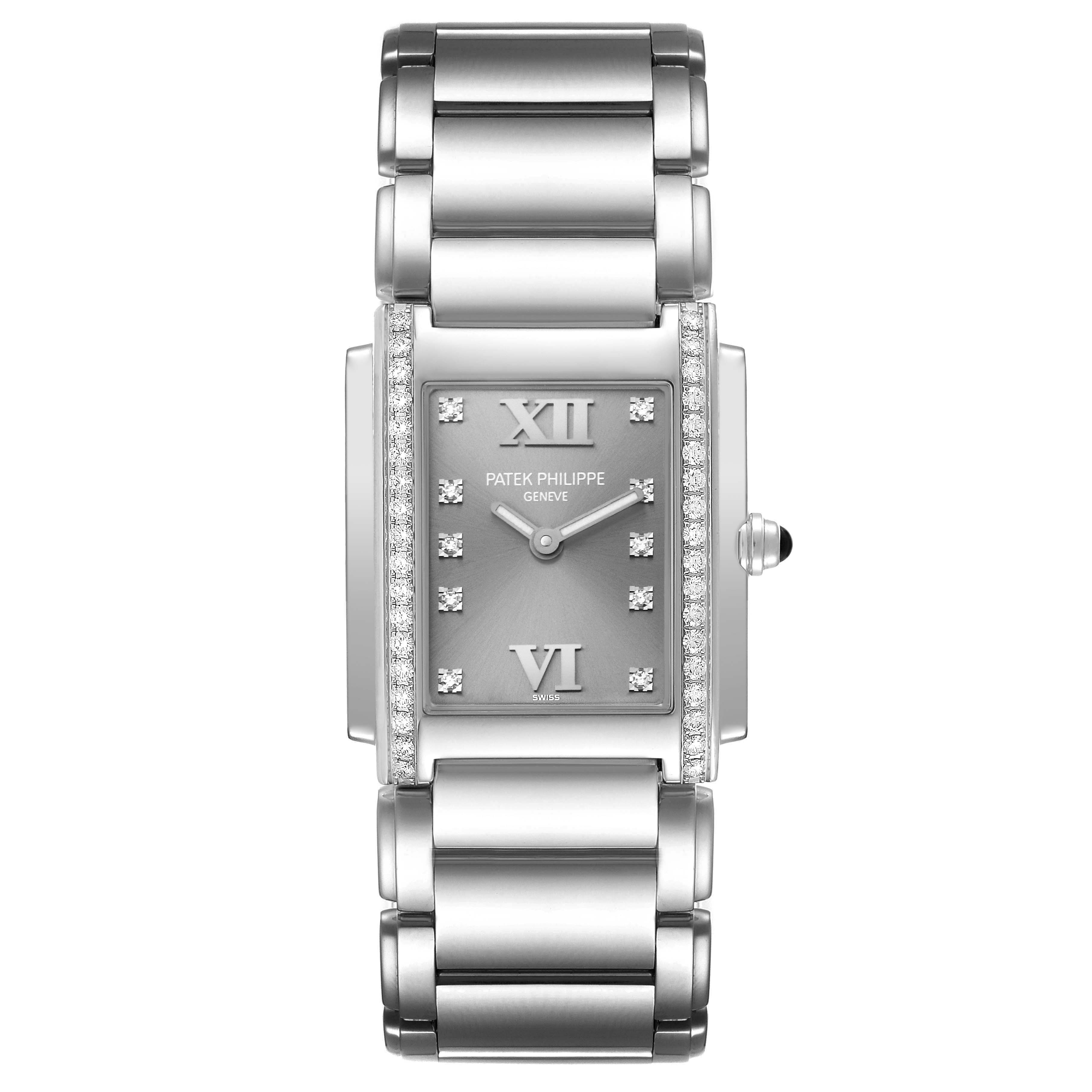 The image shows a front view of the Patek Philippe Twenty-4 4910/10 Women's Stainless Steel Grey Dial 4910/10 Women's Stainless Steel Grey Dial watch, highlighting its face, bracelet, and diamond-accented bezel.