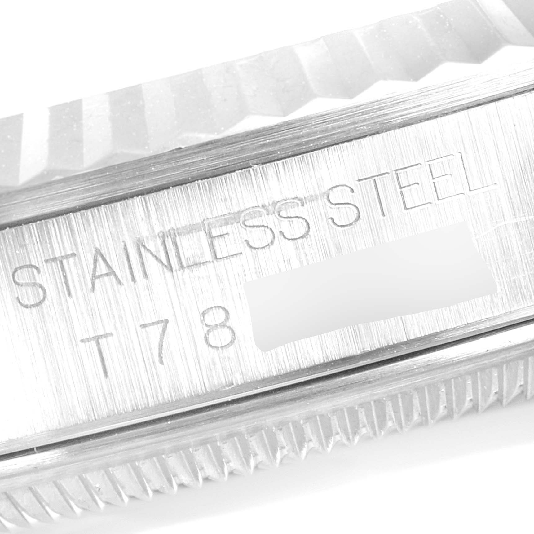 This image shows a close-up of the side view of the bezel and the steel casing with engravings on a Rolex Datejust 16234 Men's Stainless Steel Mother of Pearl Dial 16234 Men's Stainless Steel Mother of Pearl Dial watch.