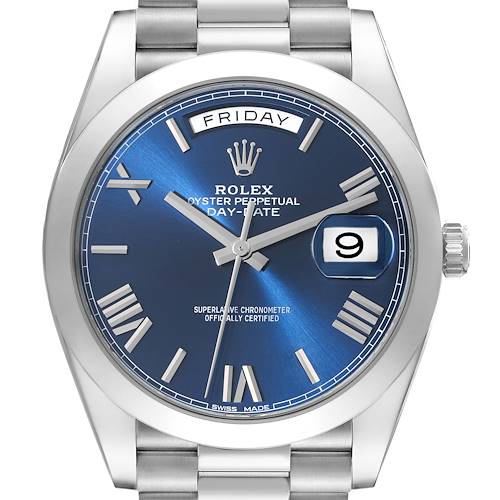 The image shows a front view of the Rolex President 228206 Men's Platinum Blue Dial 228206 Men's Platinum Blue Dial Day-Date watch with a blue dial, Roman numerals, and stainless steel bracelet.