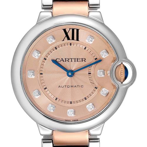This image shows a close-up, front-facing view of the Cartier Ballon Bleu WE902054 Women's Steel and Gold (two tone) Pink Dial WE902054 Women's Steel and Gold (two tone) Pink Dial watch, highlighting the dial, hands, and part of the strap.