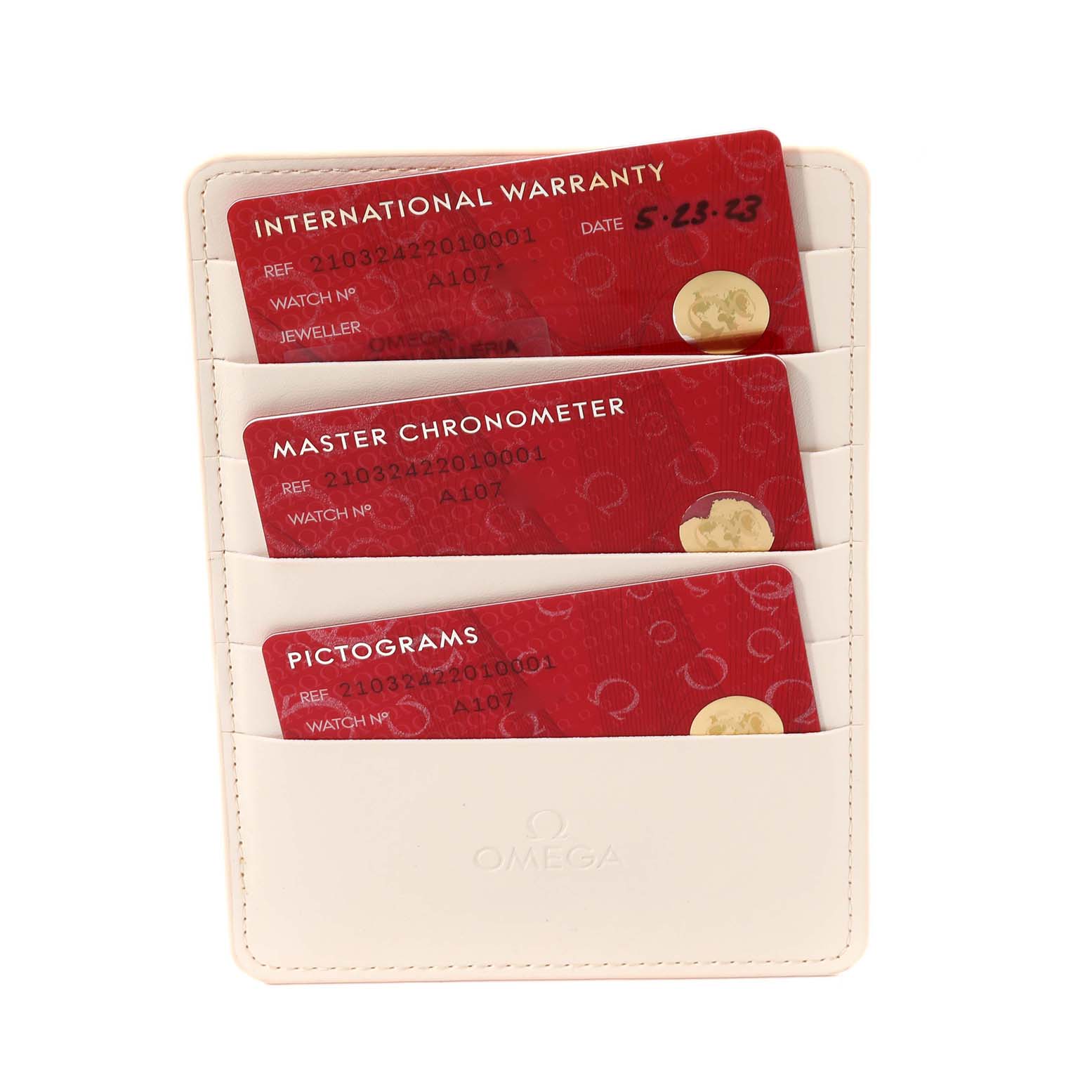 The image shows three Omega Seamaster 210.32.42.20.10.001 Men's Stainless Steel Green Dial 210.32.42.20.10.001 Men's Stainless Steel Green Dial model cards: International Warranty, Master Chronometer, and Pictograms in a cardholder.