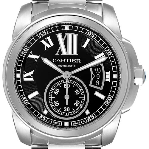 The image shows a front view of the Calibre de Cartier automatic watch by Cartier, displaying its black dial, Roman numerals, date window, and sub-dial.