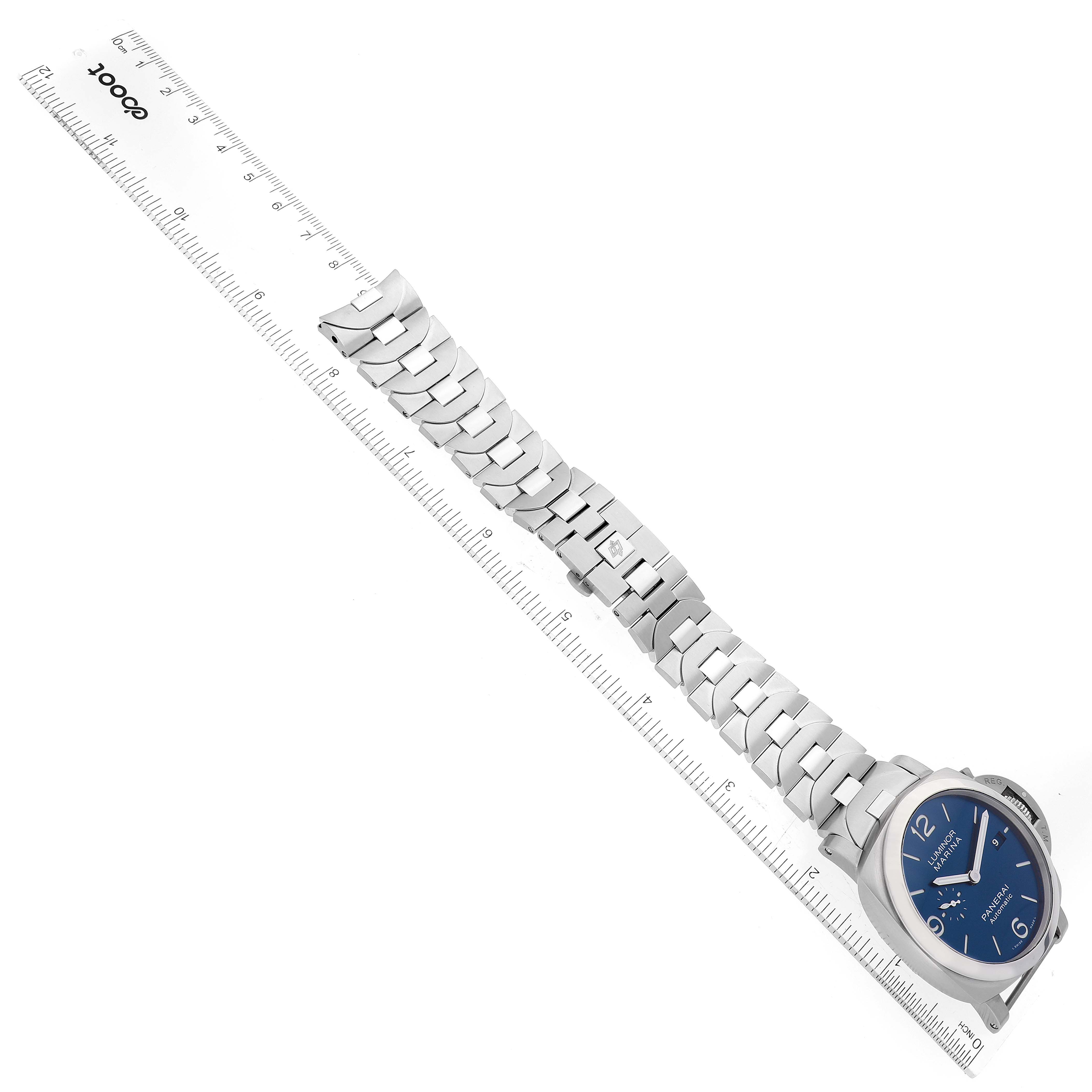 The image shows a Panerai Luminor PAM01316 Men's Stainless Steel Blue Dial PAM01316 Men's Stainless Steel Blue Dial watch laying flat with a ruler measuring its metal band.