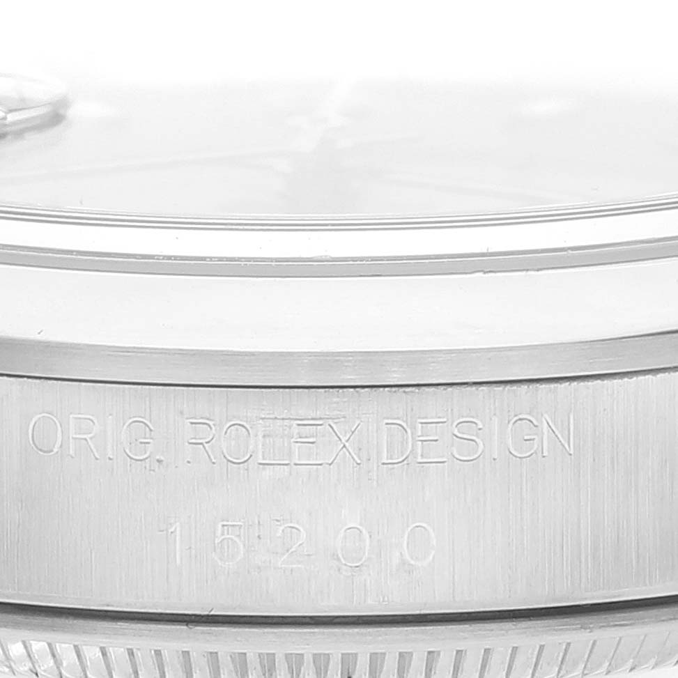This is a close-up shot of the case side of a Rolex Date 15200 Men's Stainless Steel Pink Dial 15200 Men's Stainless Steel Pink Dial model watch, highlighting the engraved text "ORIG. ROLEX DESIGN" and "15200".