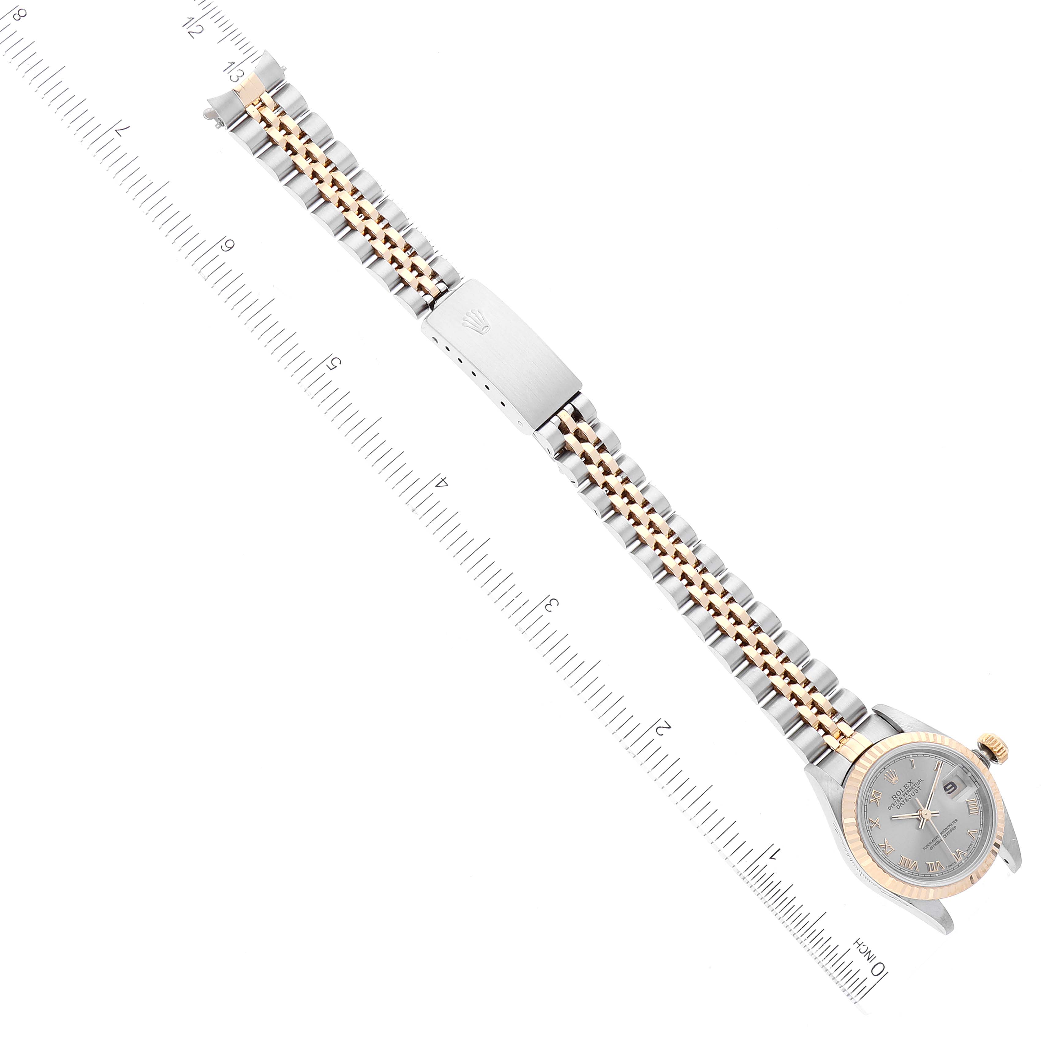 The image shows a top-down view of a Rolex Datejust 69173 Women's Steel and Gold (two tone) Grey Dial 69173 Women's Steel and Gold (two tone) Grey Dial watch featuring the full strap, clasp, and case alongside a measuring ruler.