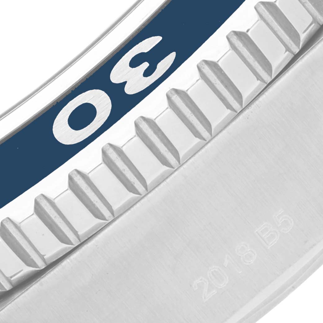 This is a close-up of the bezel and part of the casing of a Breitling Superocean A17392 Men's Stainless Steel Blue Dial A17392 Men's Stainless Steel Blue Dial watch, showing the "30" minute marker and the knurled bezel edge.