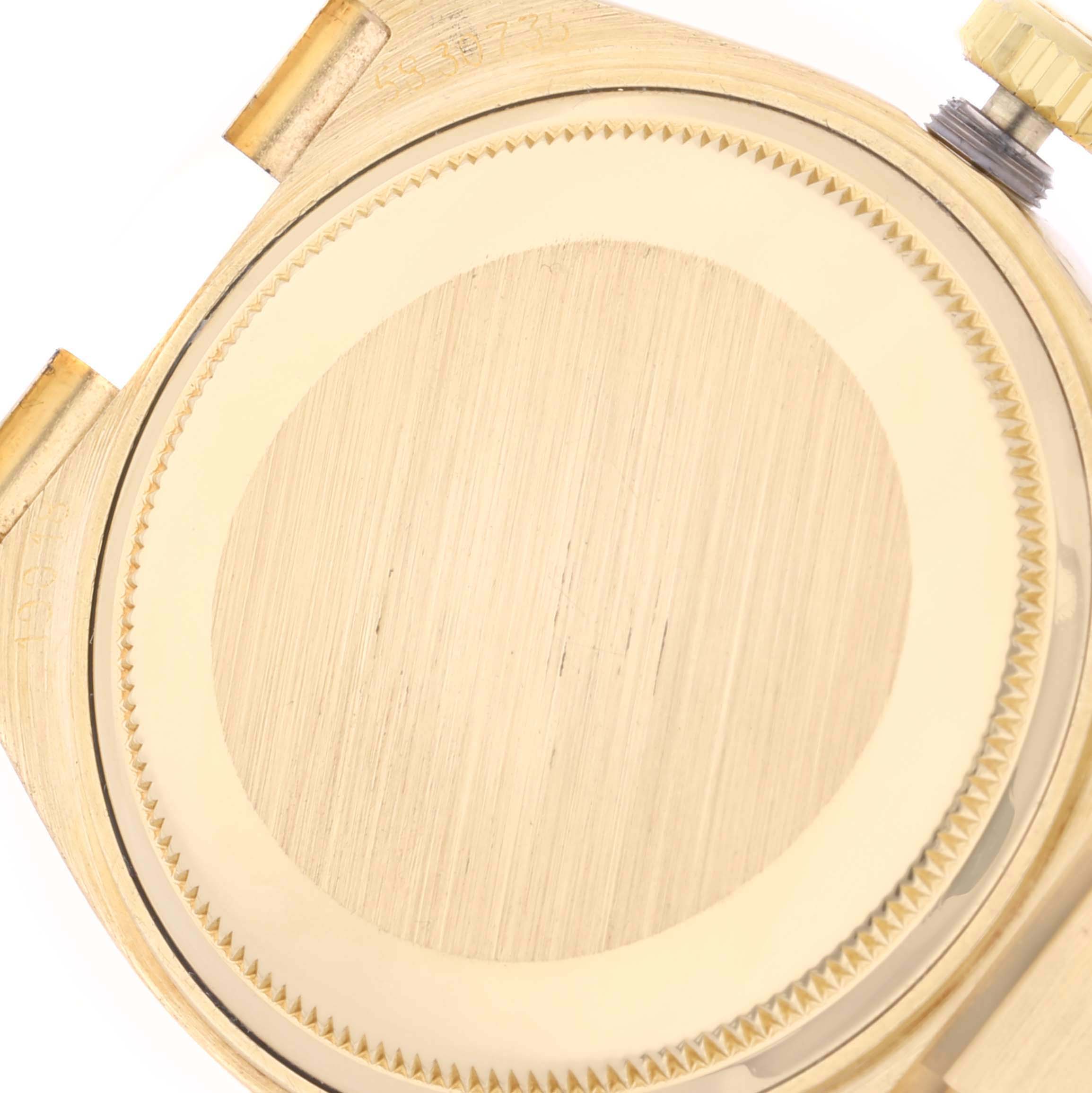 This image shows the case back and crown of a Rolex Oysterquartz 19018 Men's Yellow Gold Champagne Dial 19018 Men's Yellow Gold Champagne Dial watch from an overhead angle.