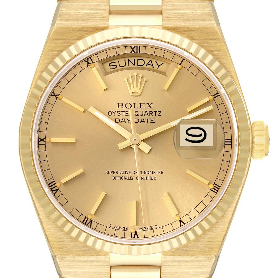 The image shows a front view of a Rolex Oysterquartz 19018 Men's Yellow Gold Champagne Dial 19018 Men's Yellow Gold Champagne Dial watch, highlighting the dial, hands, day, date display, and bezel.