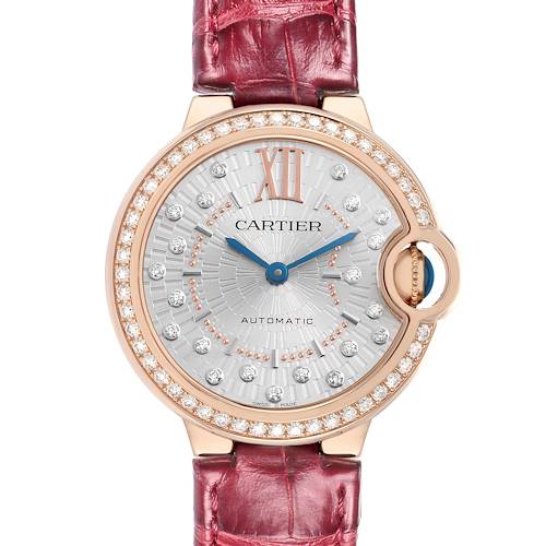 The Cartier Ballon Bleu WJBB0080 Women's Rose Gold Silver Dial watch is shown from a top view, featuring a diamond-studded bezel and a red leather strap.