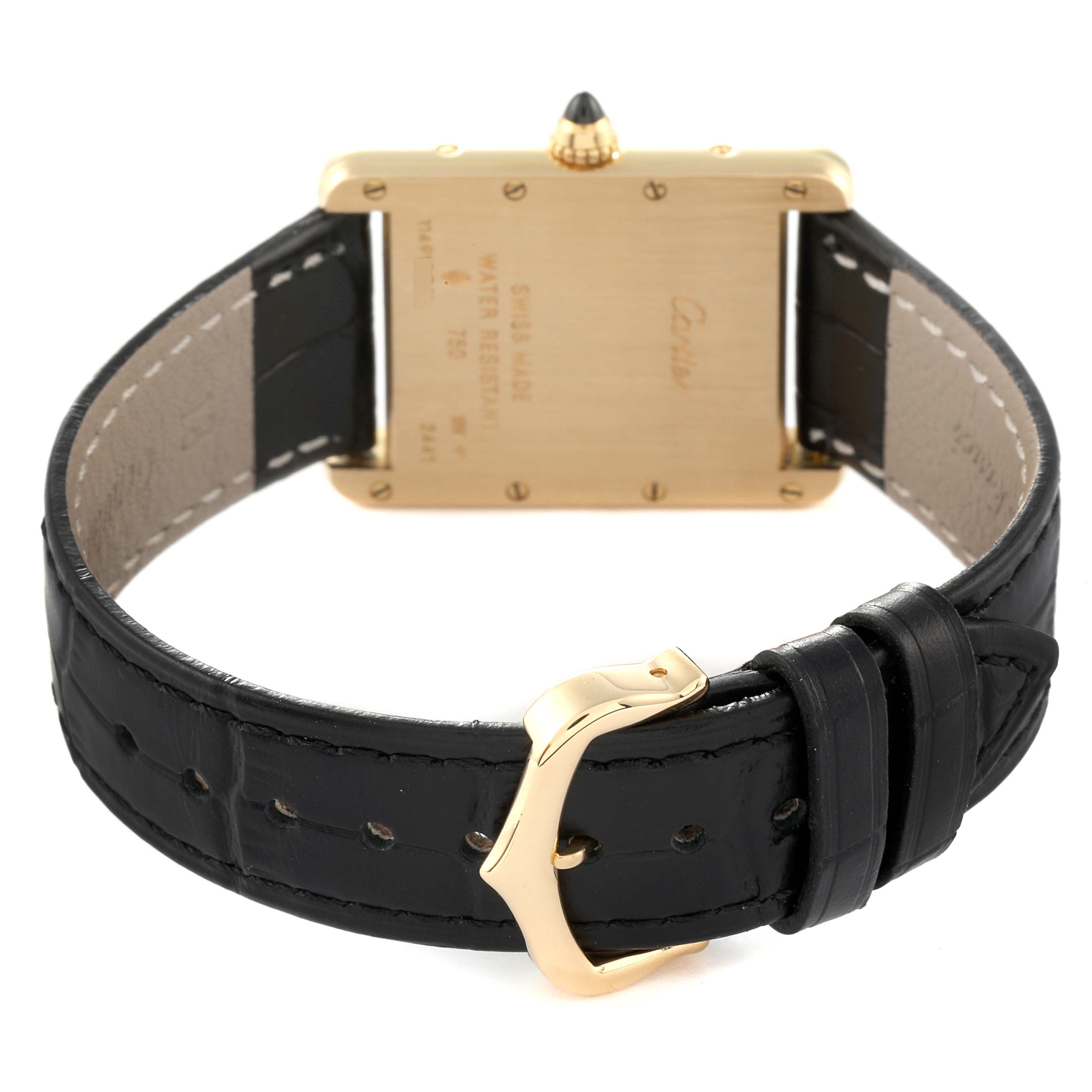 The image shows the back of a Cartier Tank Louis W1529756 Men's Yellow Gold Silver Dial W1529756 Men's Yellow Gold Silver Dial watch, highlighting its leather strap and gold-plated clasp.