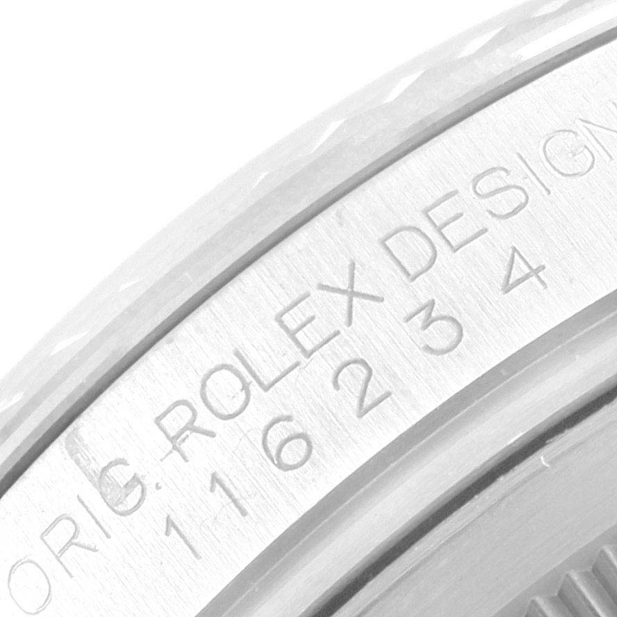 The image shows a close-up of the engraved bezel and serial number on a Rolex Datejust 116234 Men's Stainless Steel Mother of Pearl Dial 116234 Men's Stainless Steel Mother of Pearl Dial watch.