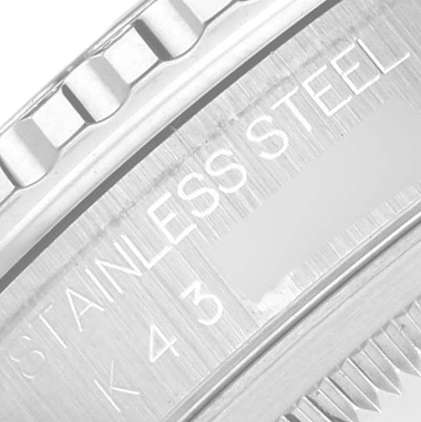This close-up image shows the side of the bezel and part of the case back with "STAINLESS STEEL" engraved on the Rolex Turn-o-Graph 16264 Men's Stainless Steel Black Dial 16264 Men's Stainless Steel Black Dial model.