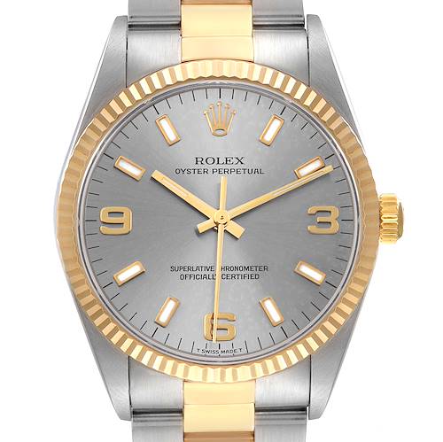 The image shows a frontal view of a Rolex Oyster Perpetual 14233 Men's Steel and Gold (two tone) Silver Dial 14233 Men's Steel and Gold (two tone) Silver Dial watch, highlighting the dial, bezel, crown, and part of the bracelet.