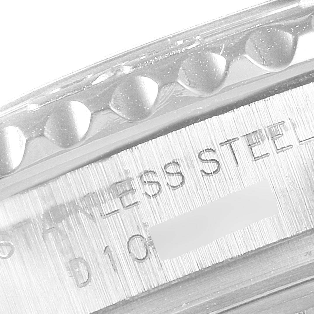 The image shows a close-up of the side of a Rolex Yacht-Master 169622 Women's Stainless Steel Silver Dial 169622 Women's Stainless Steel Silver Dial watch, specifically the knurled bezel and part of the case with "STAINLESS STEEL" engraving.