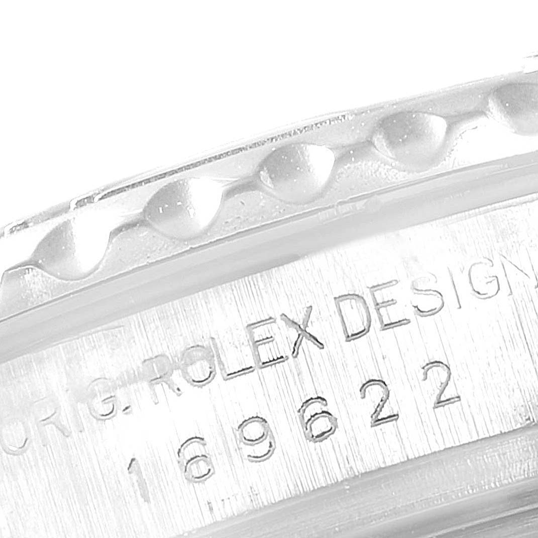 The image shows a close-up of the watch case and bezel of a Rolex Yacht-Master 169622 Women's Stainless Steel Silver Dial 169622 Women's Stainless Steel Silver Dial model, highlighting the engraving and texture.