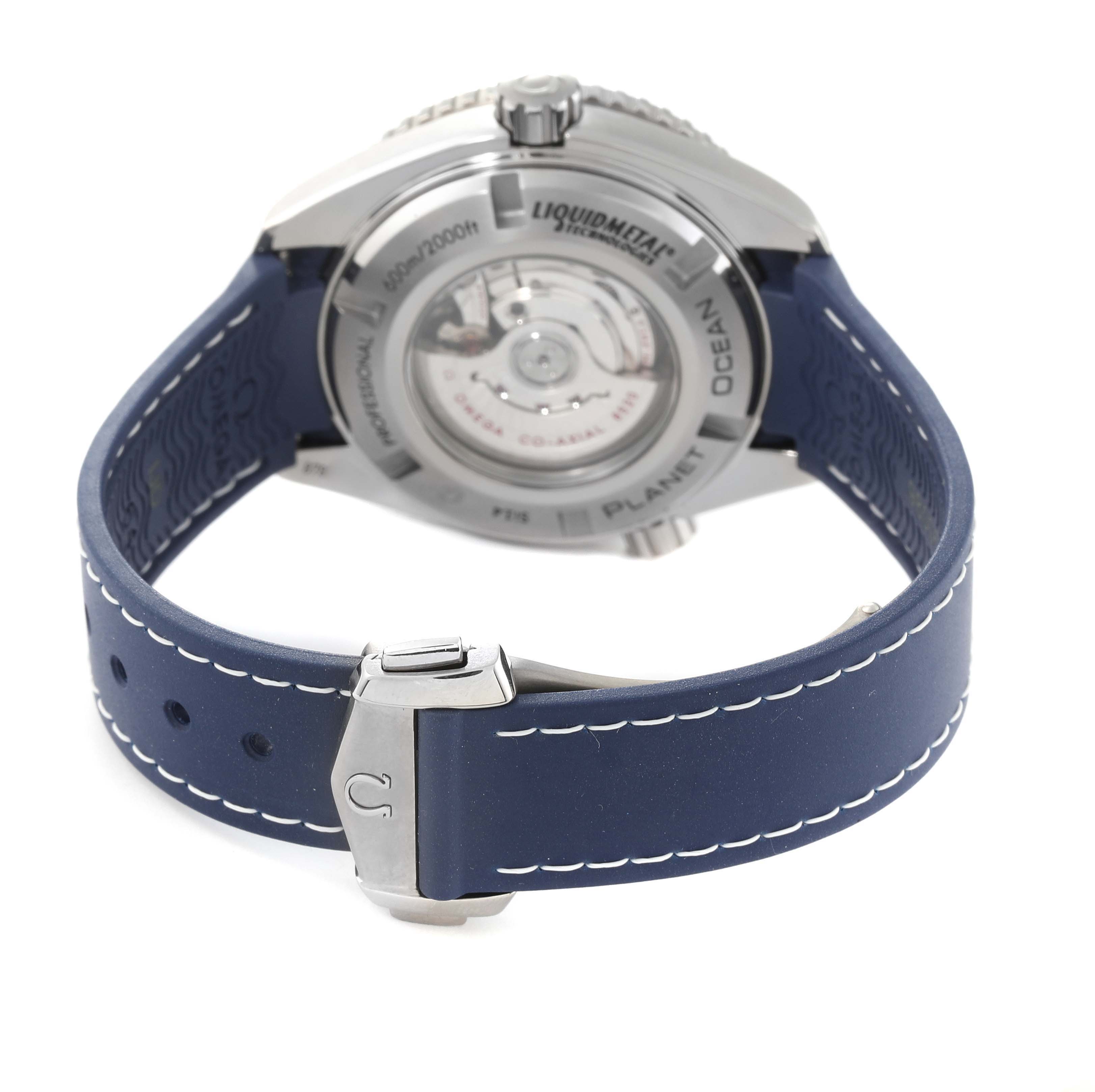 This Omega Planet Ocean 232.92.38.20.03.001 Men's Titanium Blue Dial 232.92.38.20.03.001 Men's Titanium Blue Dial watch photo shows the back side, revealing the movement and blue strap with white stitching.