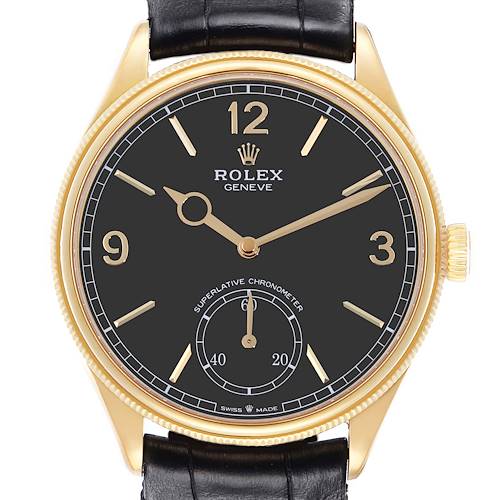 The Rolex 1908 52508 Men's Yellow Gold Black Dial watch is shown from a front angle, displaying the black dial, gold hour markers, hands, and crown.