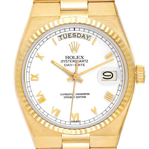 The image shows a frontal view of a Rolex Oysterquartz 19018 Men's Yellow Gold White Dial 19018 Men's Yellow Gold White Dial watch, highlighting its dial, hands, bezel, day, and date indicators.