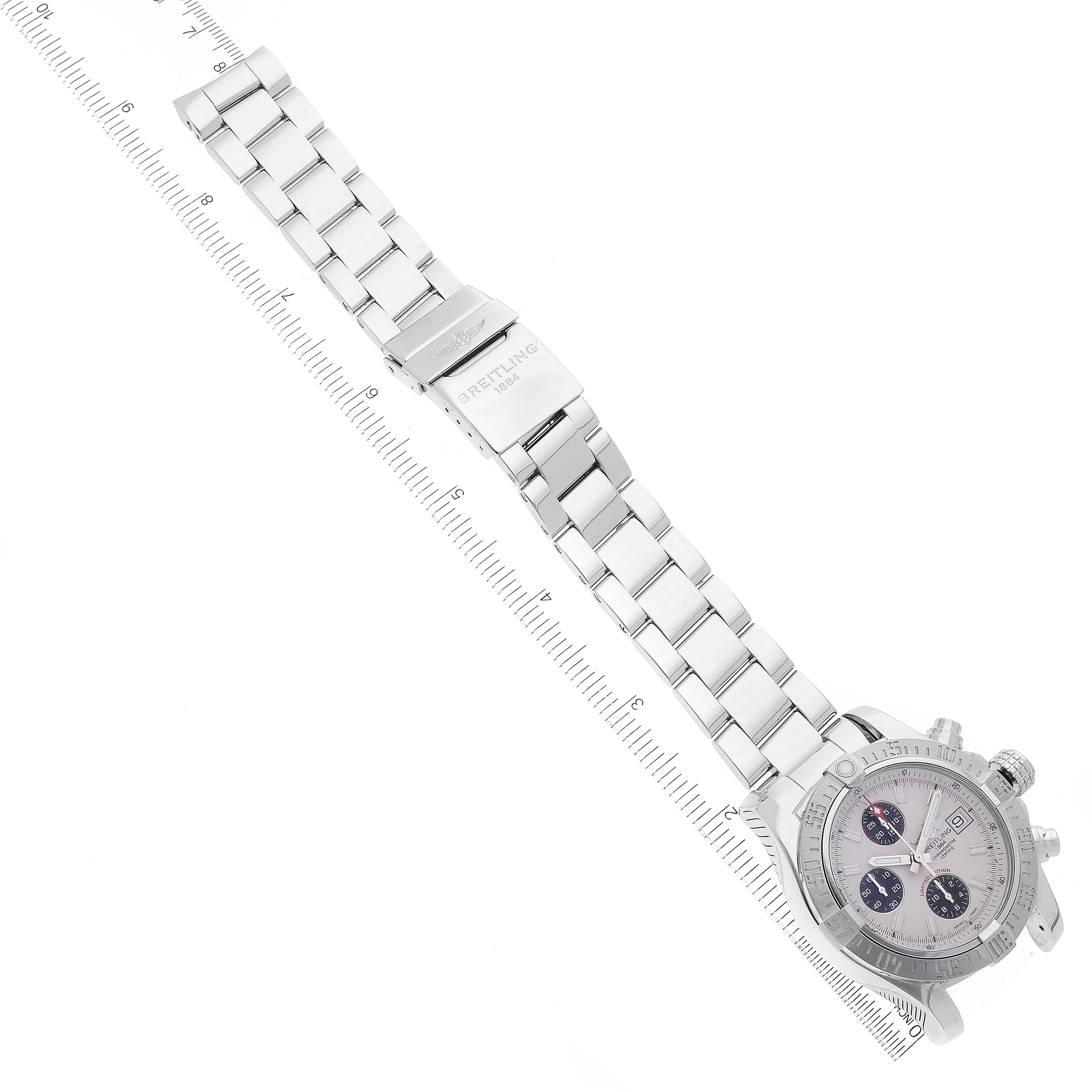 This image shows a Breitling Avenger A13381 Men's Stainless Steel White Dial A13381 Men's Stainless Steel White Dial watch laid flat with a ruler to measure its length, including the face, bezel, and metal bracelet.